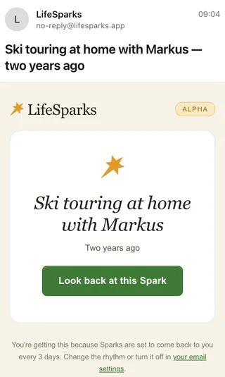 An email from LifeSparks on a phone, received two years after 30 December 2023, subject “Ski touring at home with Markus — two years ago”, with a button to look back at this Spark and a footer line saying Sparks come back every 3 days